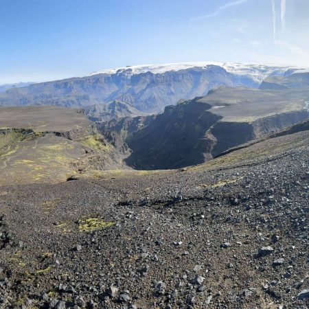 Majestic glacier landscape in Iceland with volcanic terrain and snow-capped mountains.