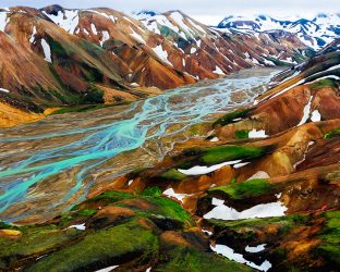 Aerial view landscape of Landmannalaugar surreal nature scenery in highland of Iceland, Europe. Beautiful colorful snow mountain terrain famous for summer trekking adventure and outdoor walking.