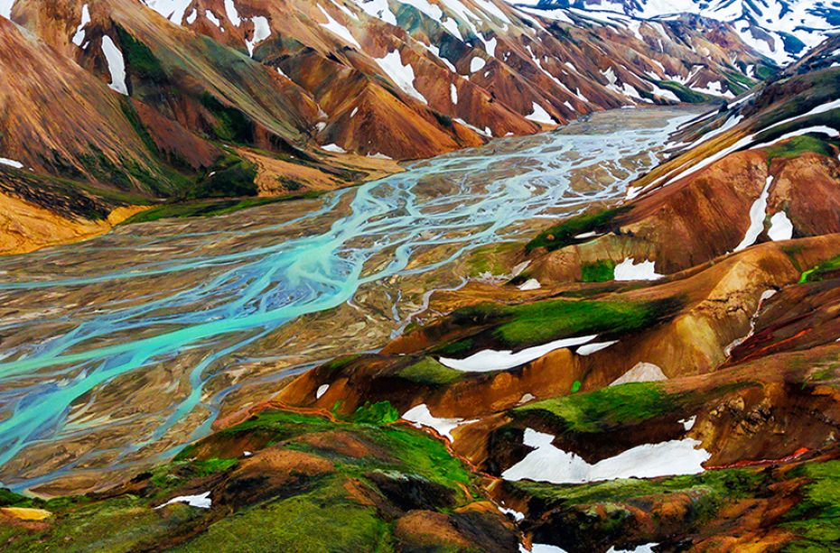 Aerial view landscape of Landmannalaugar surreal nature scenery in highland of Iceland, Europe. Beautiful colorful snow mountain terrain famous for summer trekking adventure and outdoor walking.