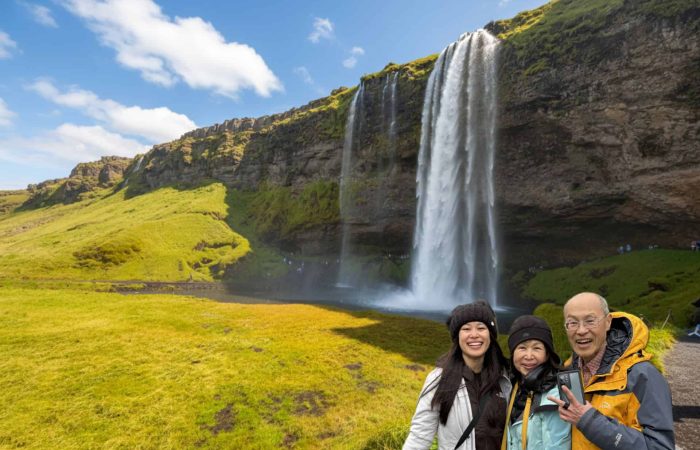 family-enjoying-seljalandsfoss-iceland