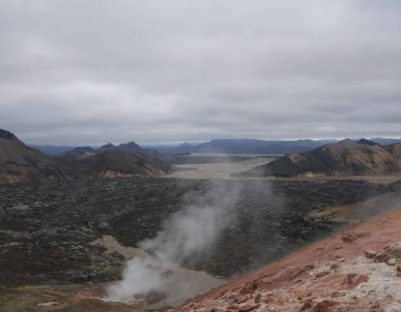 Overview of the Laugahraun lava field with geothermal steam vents on Day 02 of the Laugavegur Trek