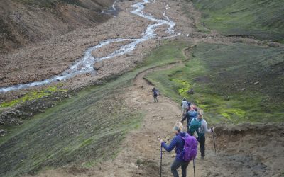 Hikers descending toward Þórsmörk on Day 04 of the Laugavegur Trek in Iceland